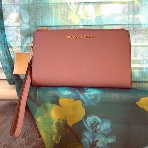 OFFERS WELCOME!! Plum Michael Kors wristlet Wallet